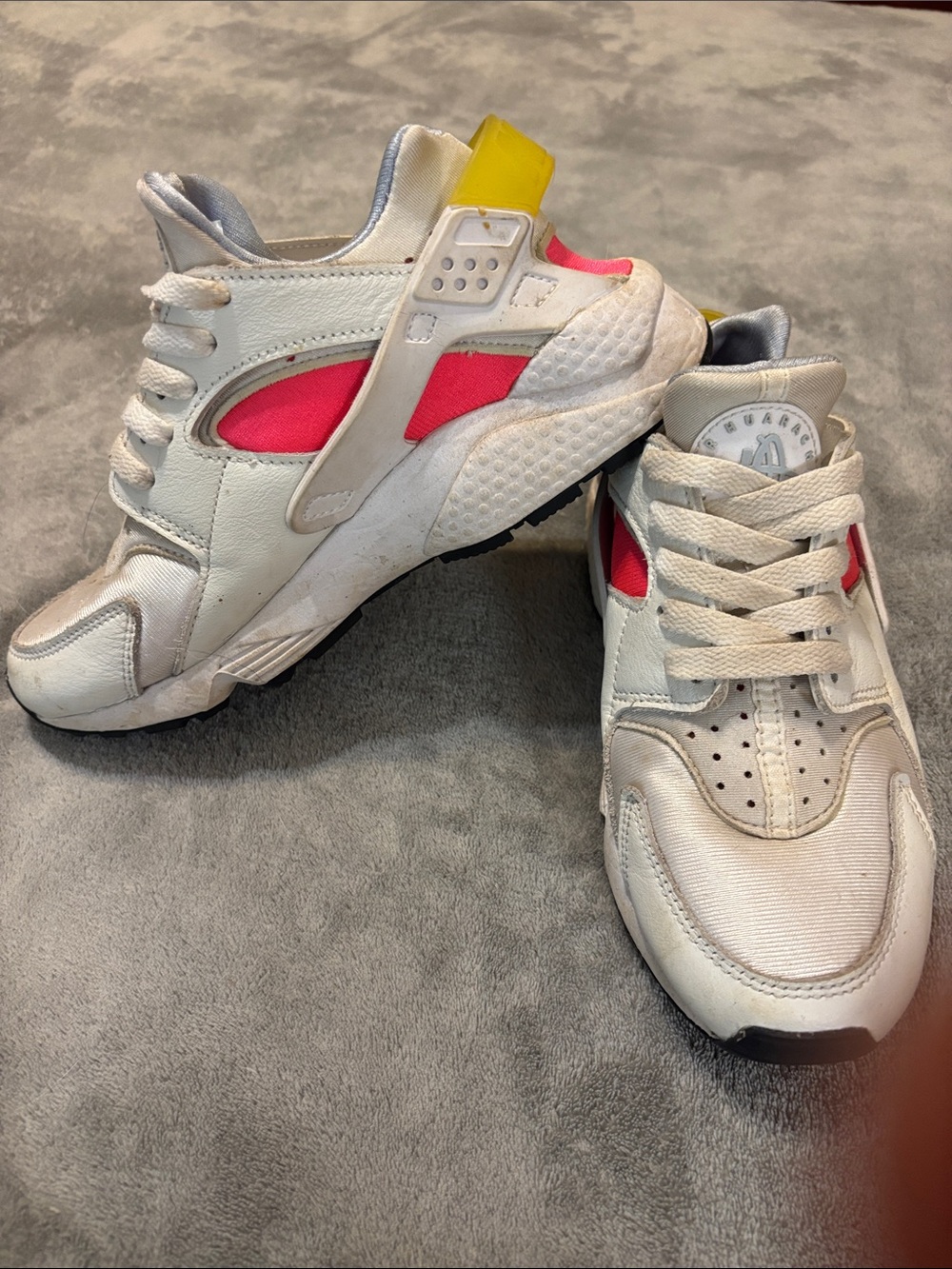 Nike White Athletic Sneakers with Pink Panels and Yellow Heel Tab